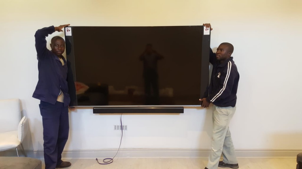 Mandla and John installing an 82